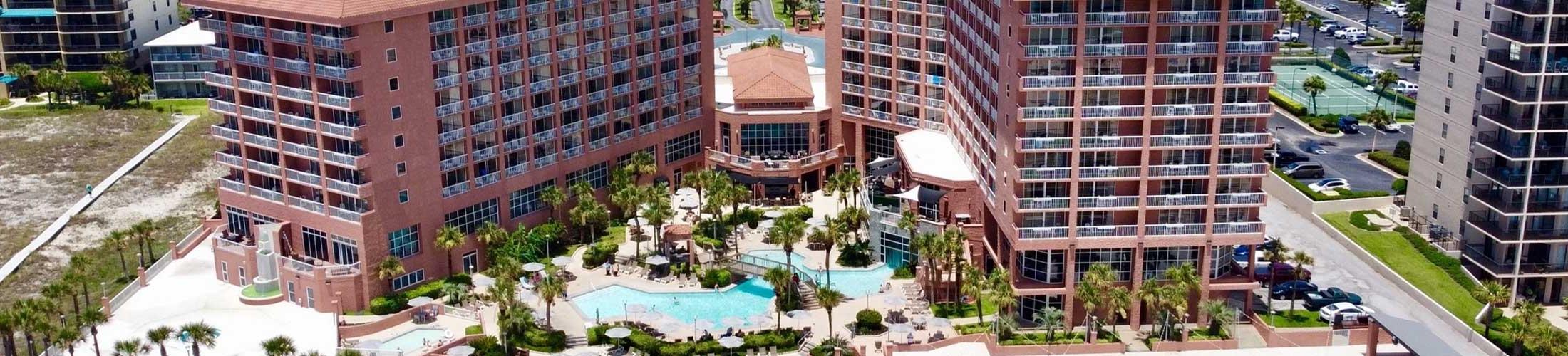 Hotel and pool at beach.